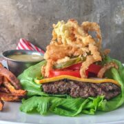 Lettuce Wrap Burger Recipe close up stacked with gray background
