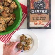 Cheesy hand grabbing for a Green Onion Sausage Balls