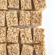 cut brown butter rice krispies treats on a white table