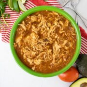 Easy Salsa Chicken in a green bowl with red napkin