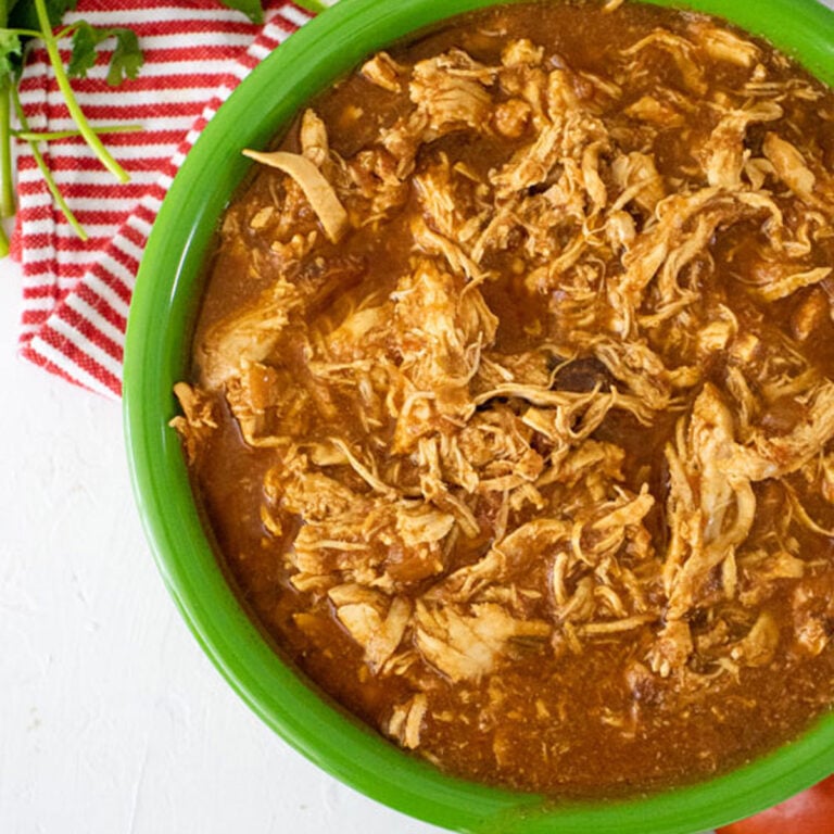 Easy Salsa Chicken in a green bowl with red napkin