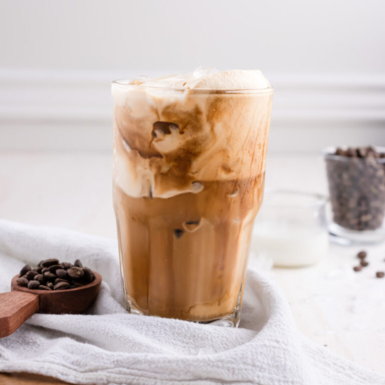 glass of greek frappe on a white table