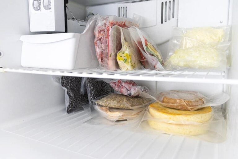 picture of inside a freezer stocked with food that has been vacuum sealed