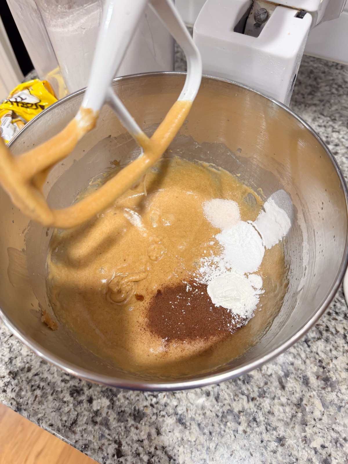 Add baking soda, salt, and espresso powder to cookie dough in a stand mixer. 