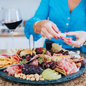 me in the kitchen making a charcuterie board.