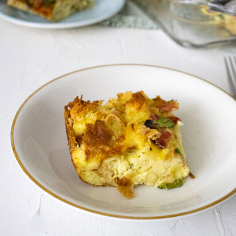 Kitchen Sink Breakfast Casserole in a clear baking pan on a white table