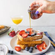 brioche french toast and pouring maple syrup over it