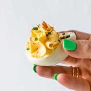 holding a deviled egg