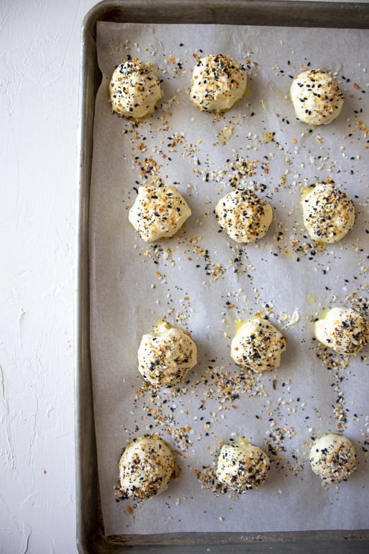 bagel bites with cream cheese before baking in the oven.