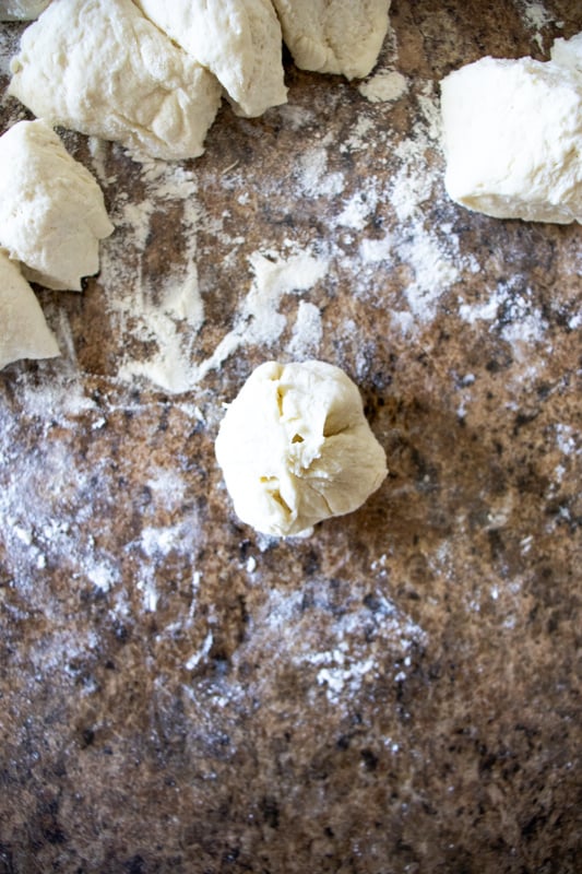 sealing the edges around a bagel bite dough ball.