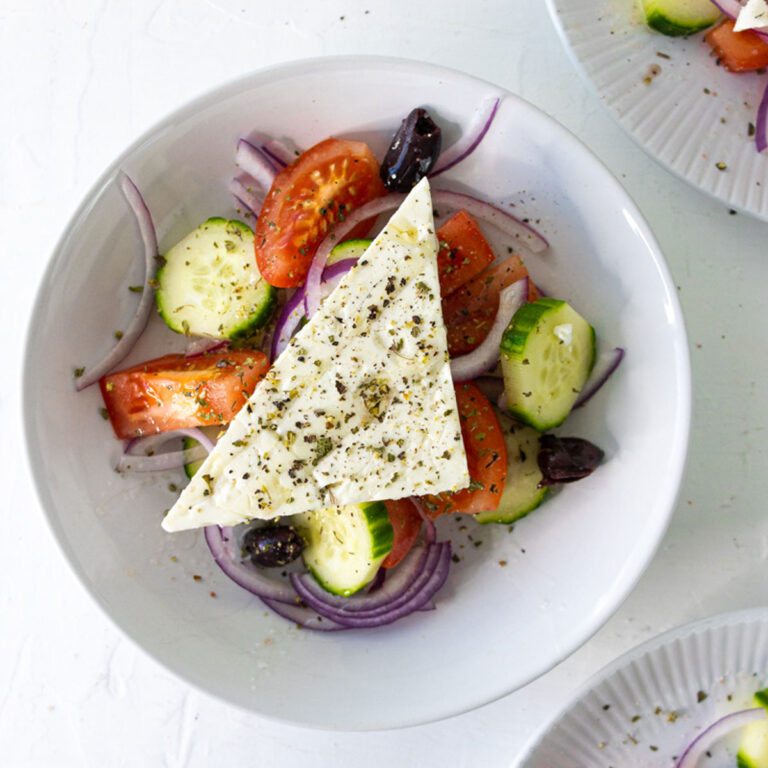 3 plates of traditional greek salad