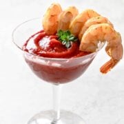 sous vide shrimp cocktail in a glass with cocktail sauce in it