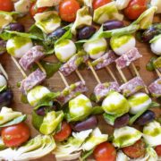Easy Antipasto Skewers lined up on a cutting board