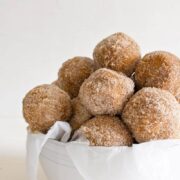 Baked Pumpkin Donut Holes in a white bowl