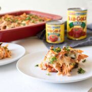 three cheese chicken penne on white plates