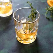 3 high ball glasses of orange and thyme bourbon infusion