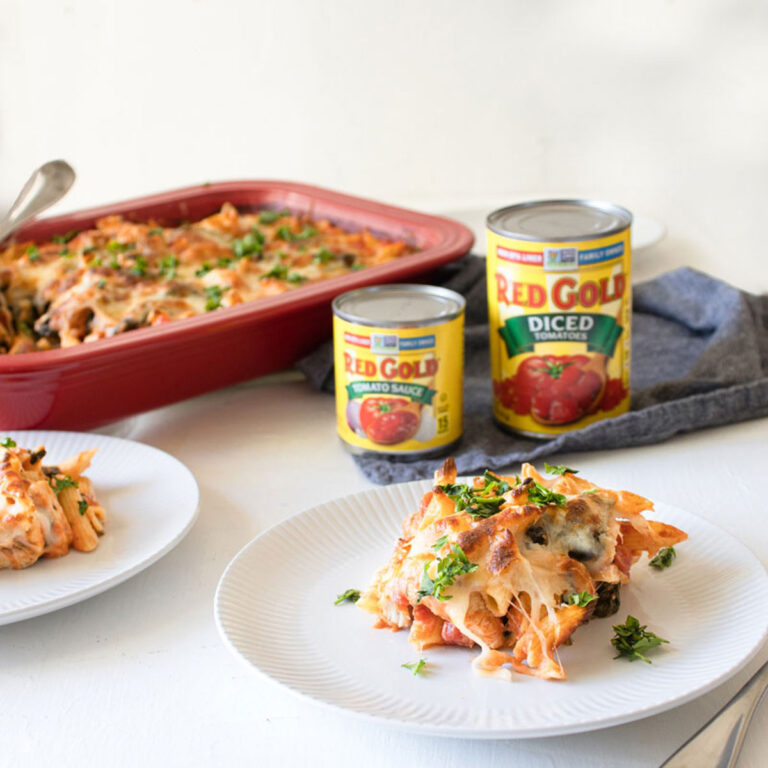 three cheese chicken penne on white plates