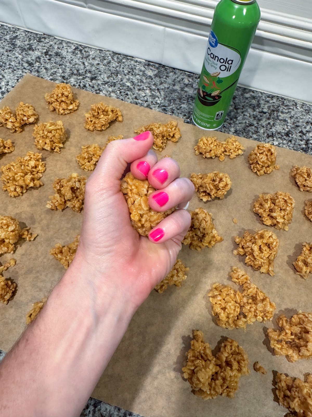squeezing peanut butter ball in my greased hand.