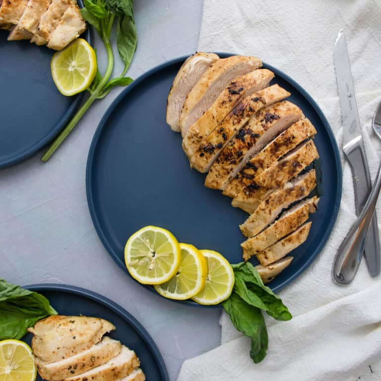 Sous Vide Honey Mustard Chicken Breast on a blue plates sliced.