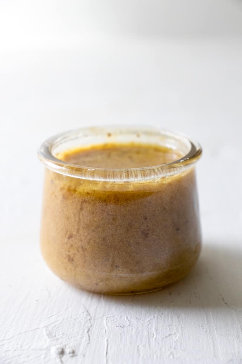 hot bacon dressing in a small jar.