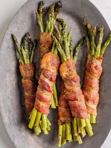 bacon wrapped asparagus on a platter