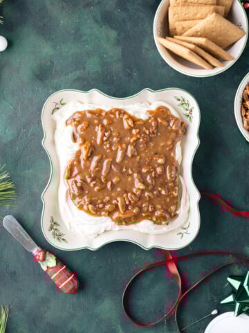 cream cheese and praline dip in a serving dish.