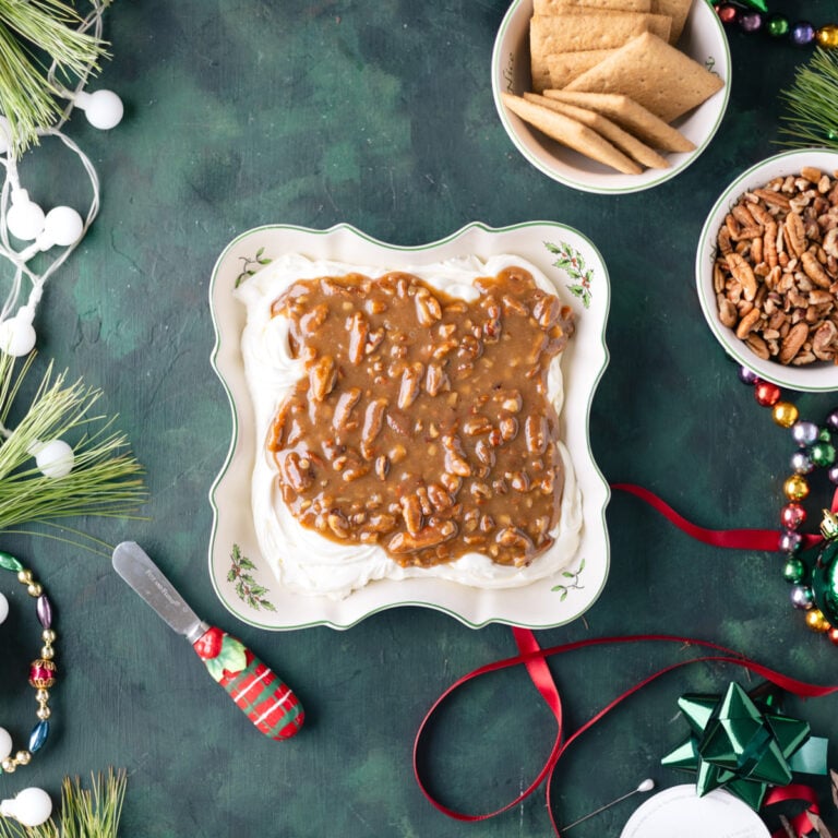 cream cheese and praline dip in a serving dish.
