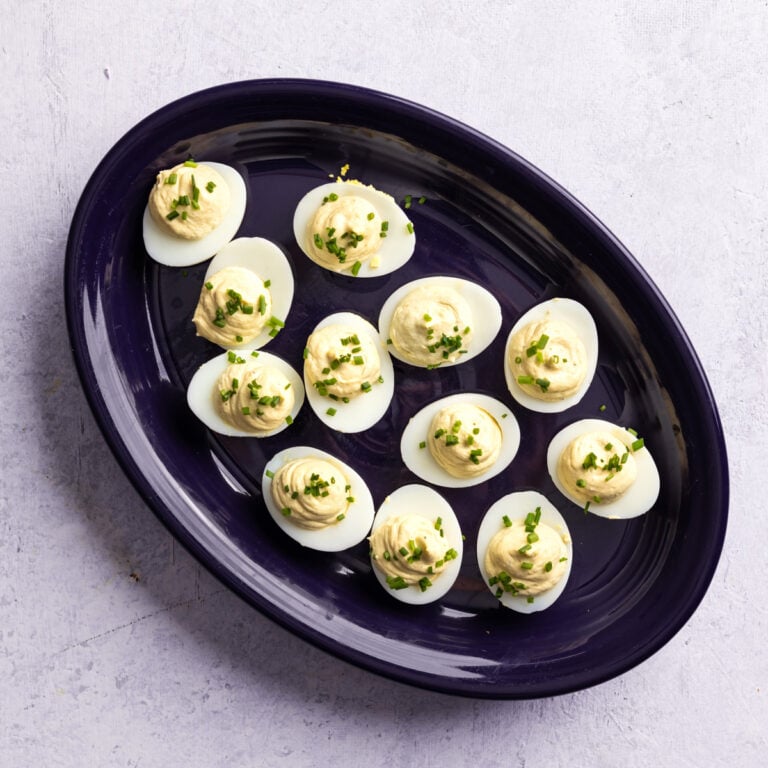 A purple platter of boursin cheese deviled eggs.
