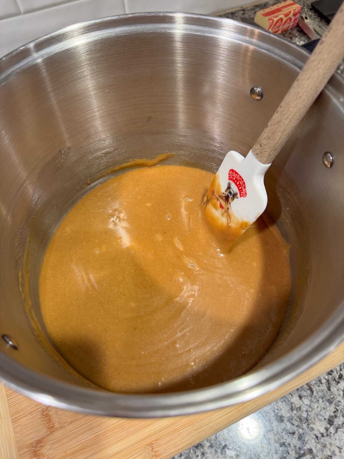 PB ball sugar mixture in a pot on the stove - smooth texture.