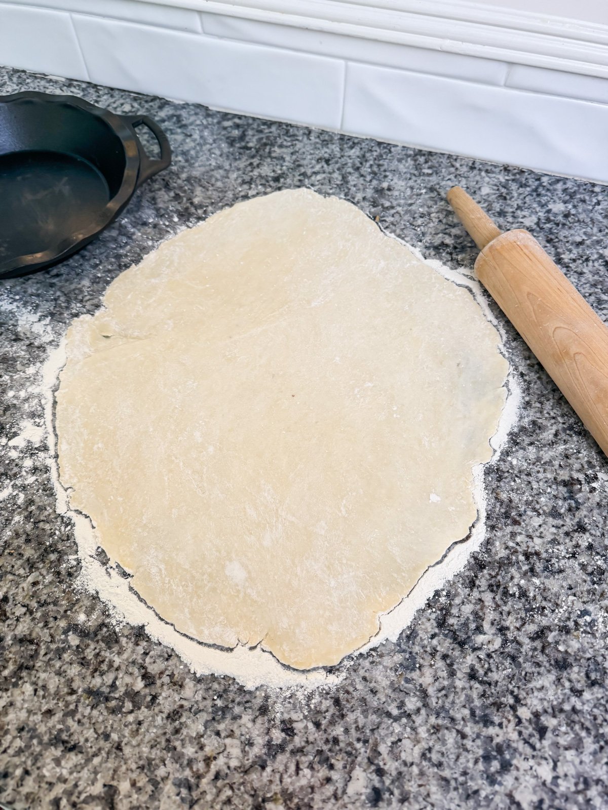 rolling out pie crust with a rolling pin. 