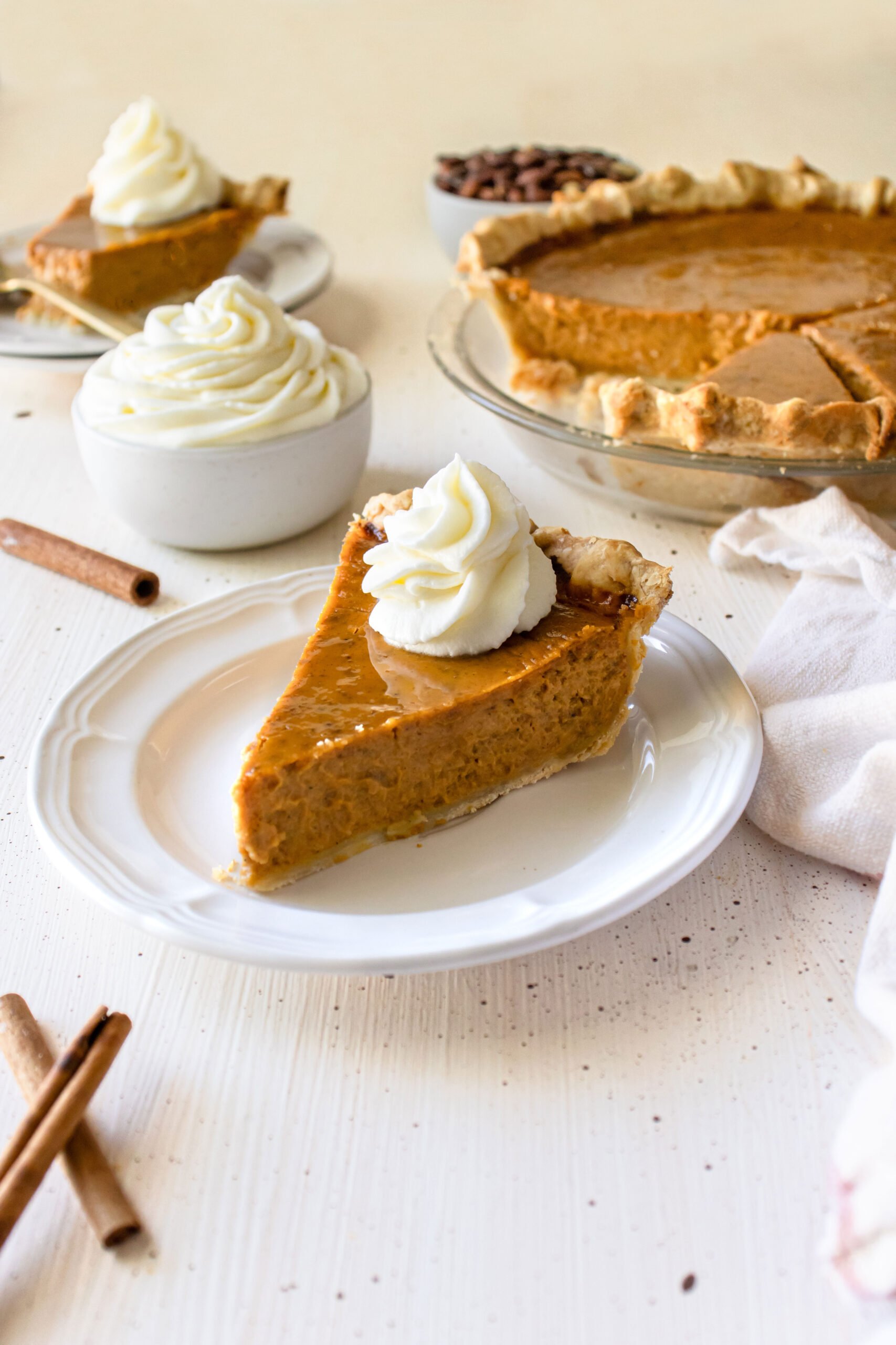 a slice of pumpkin pie on a plate