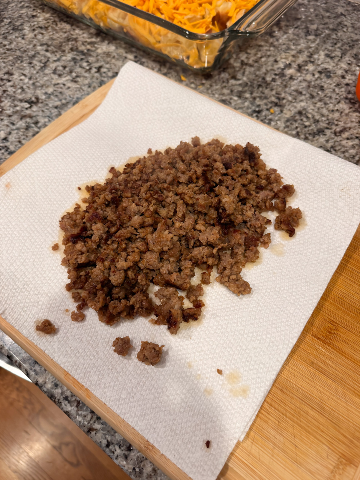 Letting cooked sausage cool on paper towels.